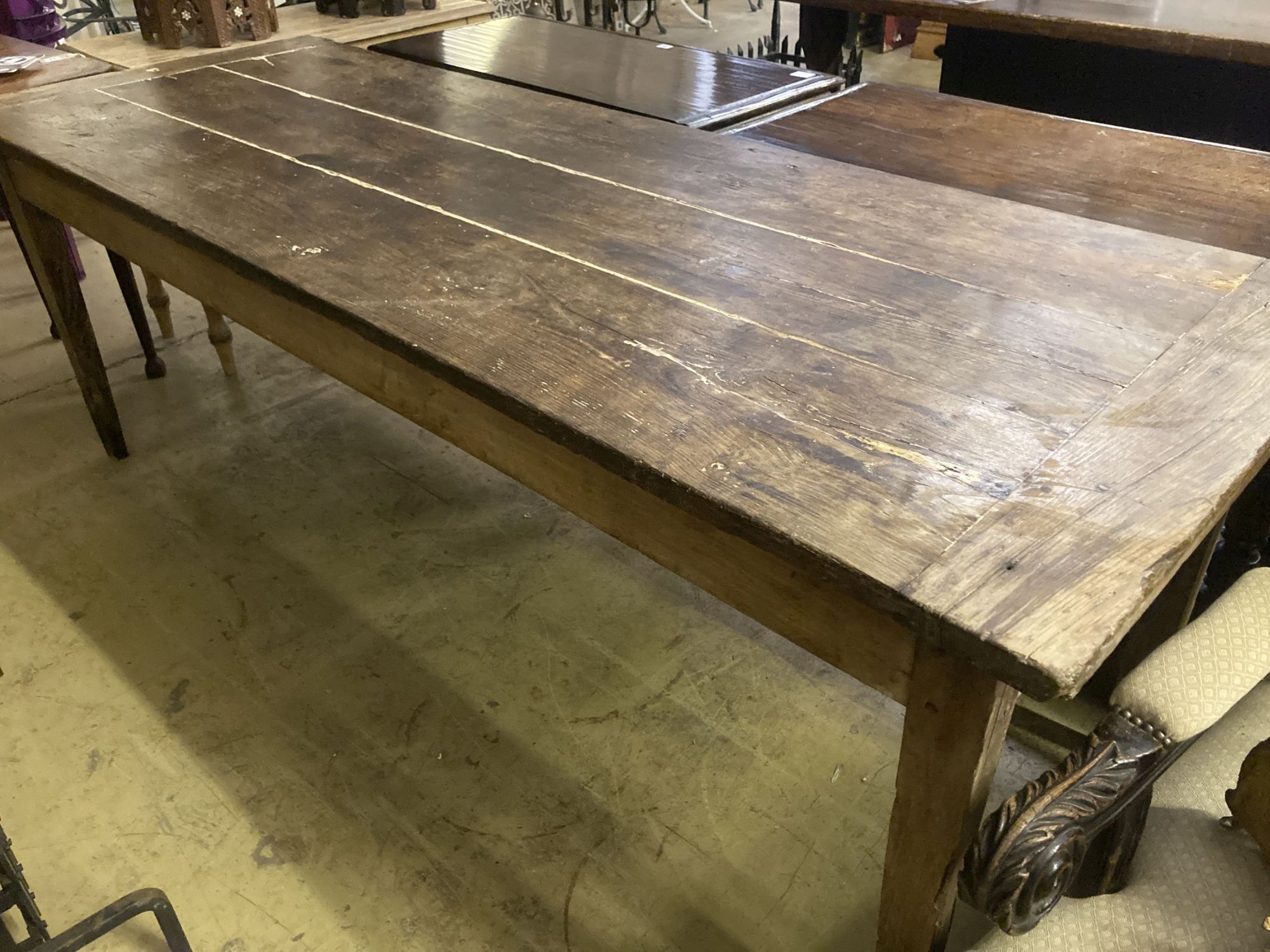 An early 19th century French oak rectangular kitchen table, length 218cm, depth 79cm, height 77cm